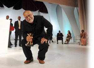 Ethiopian director Haile Gerima is pictured with the Tanit d'or trophy for his film "Teza" during the closing ceremony of the 22nd Carthage International Film Festival (JCC) on November 1, 2008 in Tunis' municipal theater. Favourite at the biennial event, notable for showcasing Arab and African films equally, was Gerima's "Teza", which made waves at the Venice Mostra last month and picked up a special jury prize. AFP PHOTO/FETHI BELAID (Photo credit should read FETHI BELAID/AFP/Getty Images)
